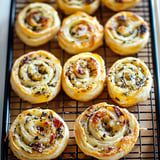 A tray of pastries with a variety of flavors.