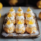 A tray of lemon meringue desserts.